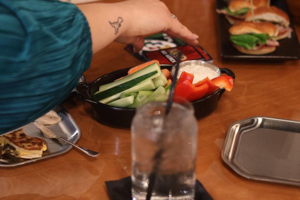 Sliders and a veggie plate on the table