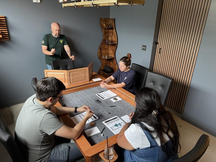 A Dungeon Master leading a King's Quest table