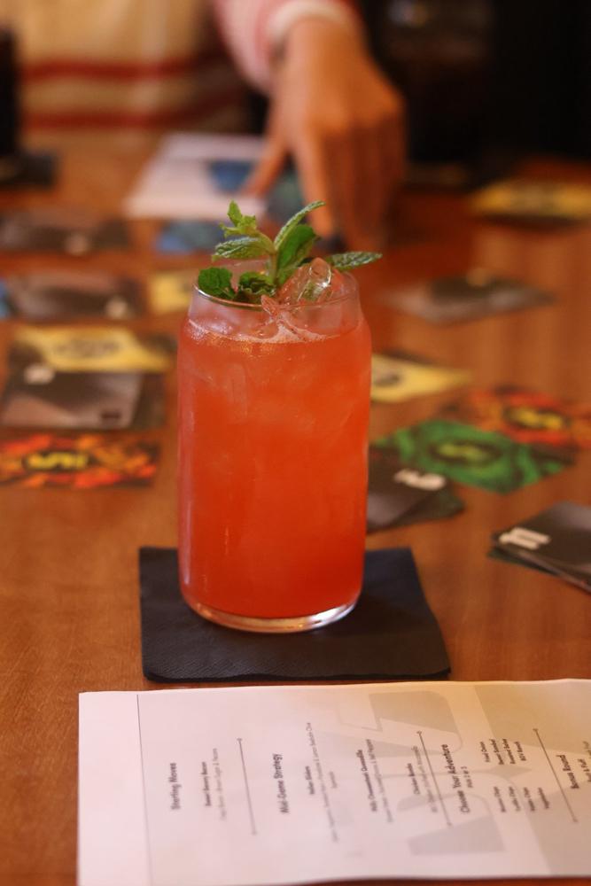 A cocktail and the drink menu